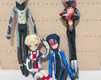 May include: Four plush dolls featuring anime-style characters with distinct outfits. One tall figure has a pale face and gray suit, another has pink hair and a black suit, while two smaller figures wear white and blue jackets respectively.