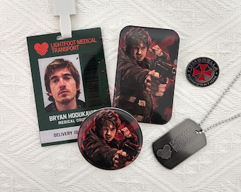 May include: A Lightfoot Medical Transport ID badge with a lanyard, a rectangular magnet, a circular pin, and a metal dog tag on a chain. The ID features a photo of a man and the text Bryan Hodukavich. The magnet and pin show a man holding a handgun.