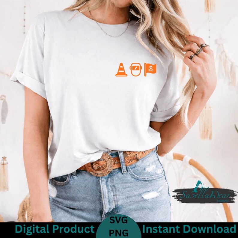 May include: White t-shirt with orange graphic of a traffic cone, welding mask, and pirate flag. The shirt is a digital product available as an SVG and PNG file.