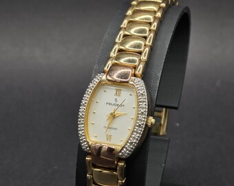Vintage peugeot Uhr goldfarbene Damen Quarz - Armband Uhr .