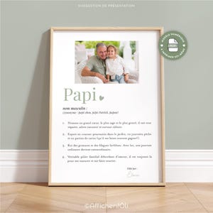 May include: A framed print with the word "Papi" in green, featuring a photo of a man and a child. The print includes a definition and characteristics of "Papi" in French. A digital PDF icon is in the upper right corner.
