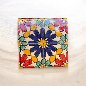 May include: A set of three ceramic mugs with a speckled, matte finish. The mugs are in shades of cream, light gray, and dark gray. Each mug has a simple, minimalist design, perfect for coffee or tea.