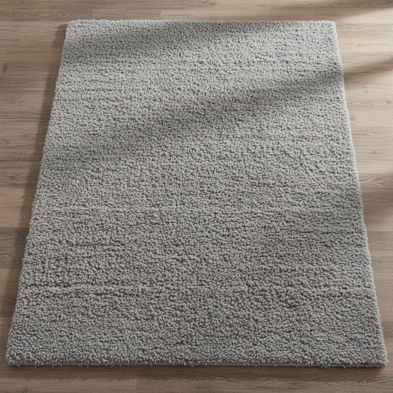 Mustard hand-tufted shag rug in a modern living room; soft yellow solid-color wool rug on light wood floor.
