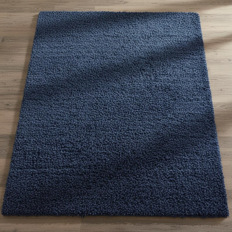 Mustard hand-tufted shag rug in a modern living room; soft yellow solid-color wool rug on light wood floor.