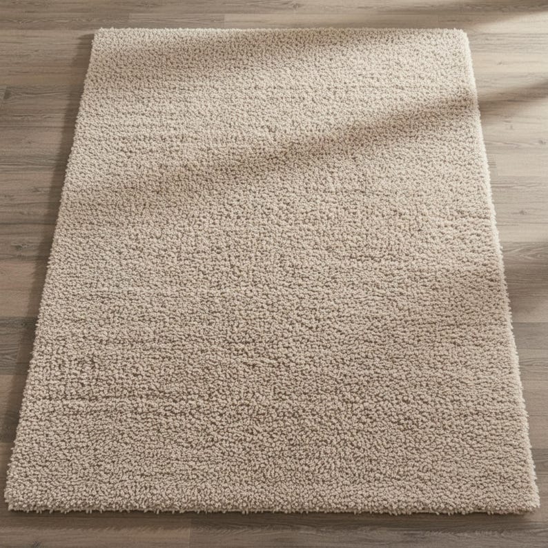Mustard hand-tufted shag rug in a modern living room; soft yellow solid-color wool rug on light wood floor.