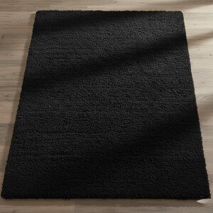 Mustard hand-tufted shag rug in a modern living room; soft yellow solid-color wool rug on light wood floor.