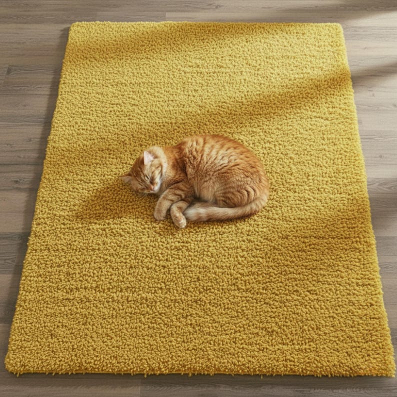 Mustard hand-tufted shag rug in a modern living room; soft yellow solid-color wool rug on light wood floor.