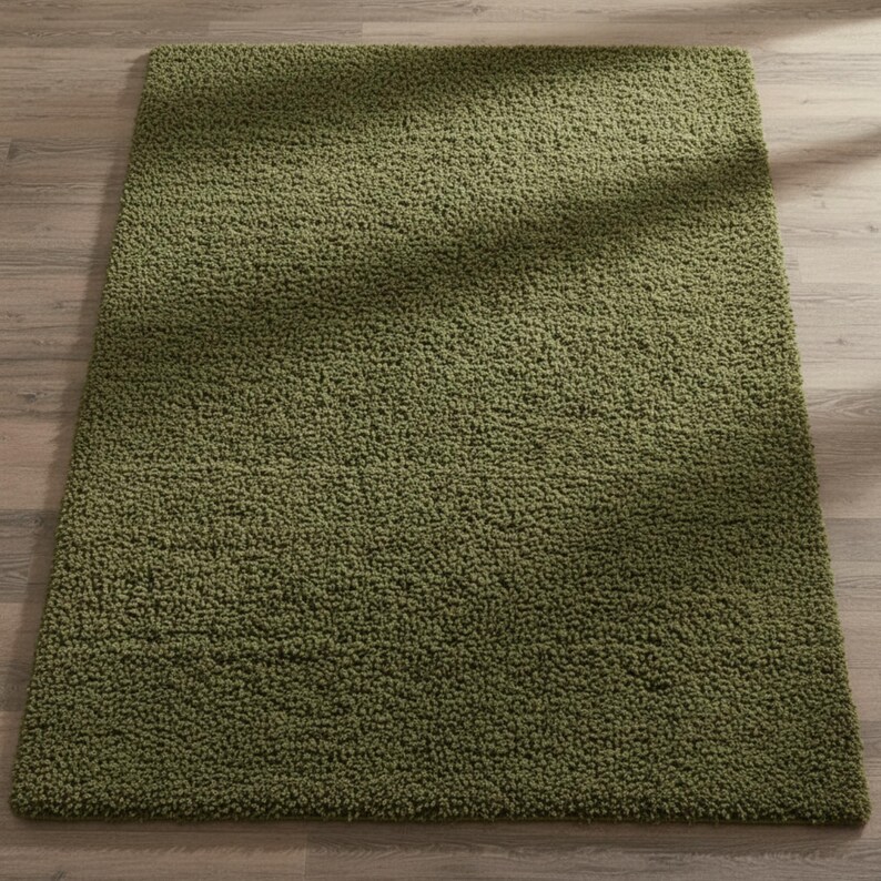 Mustard hand-tufted shag rug in a modern living room; soft yellow solid-color wool rug on light wood floor.