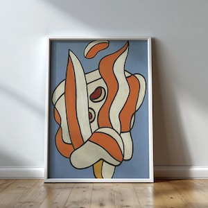 May include: Abstract art print in a white frame. The artwork features a composition of orange, cream, and black shapes against a light blue background. The framed art is displayed against a white wall and wooden floor.