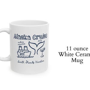 May include: White ceramic mug with a handle, featuring a blue illustration of a cruise ship, whale tail, and cocktail glass. Text reads "Alaska Cruise 2026" and "Smith Family Vacation". Holds 11 ounces.