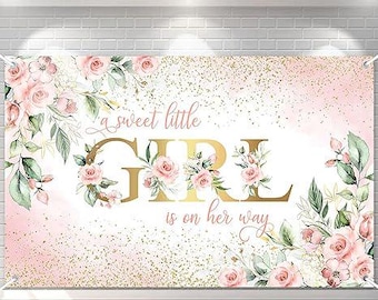 May include: A pink and gold banner with the text "a sweet little GIRL is on her way." The banner features floral arrangements with pink roses and green leaves. Gold glitter accents the background.
