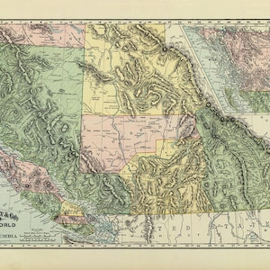 May include: A vintage map of British Columbia, Canada, showing detailed topography and political boundaries. The map is printed in shades of green, yellow, and pink, with black lines for rivers and roads. The map is titled "Rand McNally & Co.'s Atlas of the World Map of British Columbia."