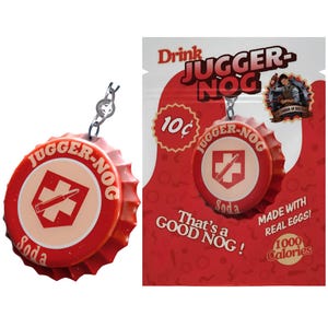 May include: A red and cream-colored JUGGER-NOG soda bottle cap keychain. The cap features the text "JUGGER-NOG Soda" and a crosshair design. The background shows a red advertisement with the text "Drink JUGGER-NOG".