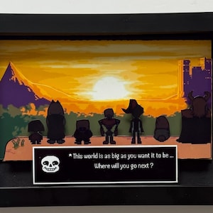 May include: A 3D shadow box art piece in a black frame featuring a pixelated sunset landscape with seven silhouettes standing on a cliff. A white rectangular text box at the bottom displays a pixelated skull and the text: This world is as big as you want it to be ... Where will you go next ?