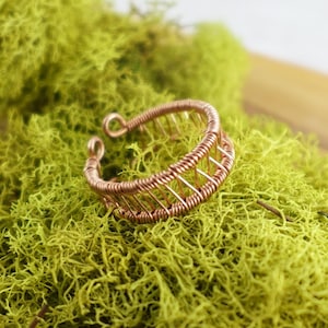 May include: A set of three ceramic nesting bowls in shades of blue, green, and white. The bowls feature a speckled glaze and a simple, modern design. Each bowl is a different size, with the largest measuring approximately 6 inches in diameter.