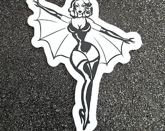 May include: Black and white illustration of a woman with bat wings, wearing a black bodysuit and stockings.