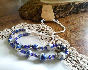 Necklace ~ Handmade polymerized paper BEADS and Knotted Artisan Motifs with blue and white accents