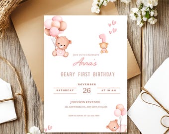 May include: A baby's first birthday invitation with a teddy bear theme. The invitation features a cute teddy bear holding balloons, with the text "Anna's Beary First Birthday" and event details. The color scheme includes pink and brown.