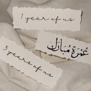Rip effect card cake topper with cursive writing