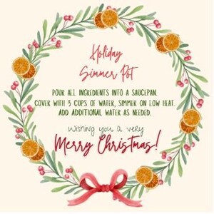 May include: A circular wreath with green leaves, red berries, and dried orange slices. The text "Holiday Simmer Pot" is in red script, along with instructions and the phrase "Merry Christmas!"