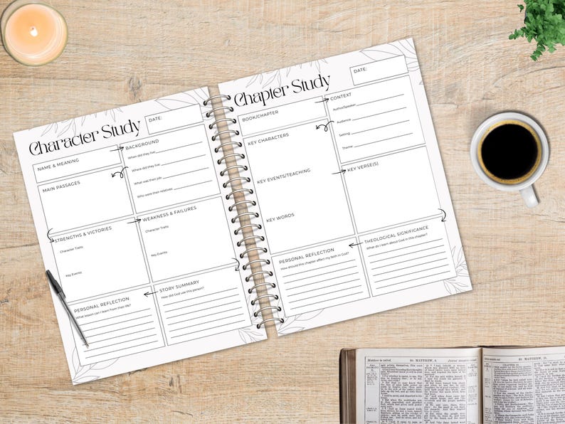 May include: Open spiral-bound notebook with "Character Study" and "Chapter Study" headings, featuring fill-in sections for notes. A pen rests on the page. A cup of coffee and a candle are on the wooden surface.