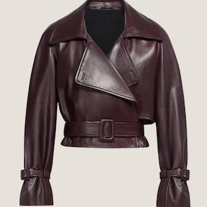 11. Close-up of genuine lambskin leather texture and belt detail on women’s jacket