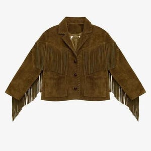 May include: A brown suede jacket with fringe detailing. The jacket has a collared neckline, two front pockets, and button closures. The fringe is along the sleeves and across the chest.