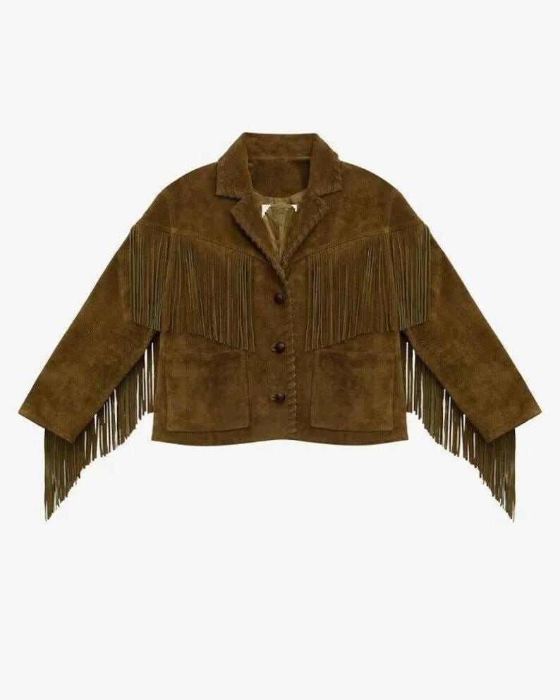 May include: A brown suede jacket with fringe detailing. The jacket has a collared neckline, two front pockets, and button closures. The fringe is along the sleeves and across the chest.