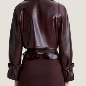 12. Waist belt and zipper detail of cropped leather streetwear coat