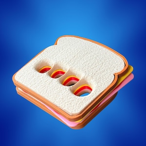 May include: A sandwich-shaped object with a textured white top layer featuring four diagonal cutouts that reveal rainbow-coloured interior layers. The structure includes a pink middle layer and a brown base layer, all stacked in a square shape.