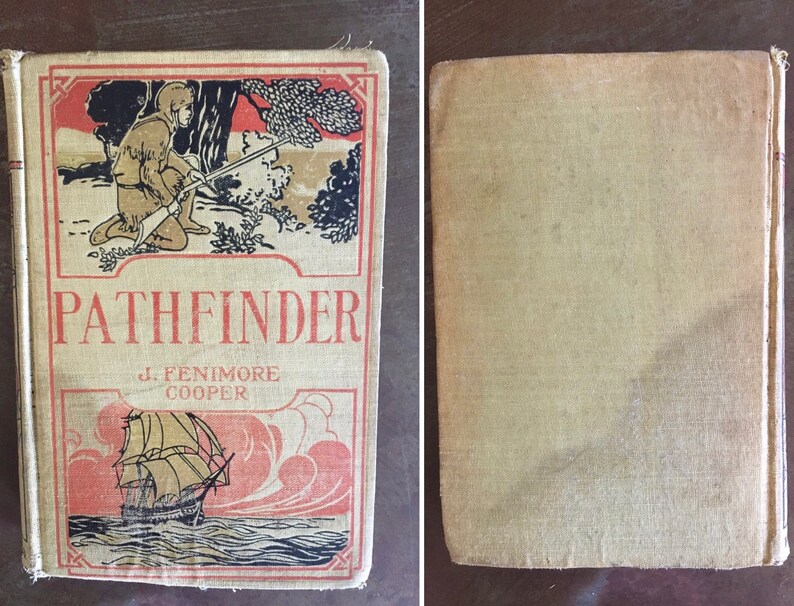 May include: A vintage book titled "PATHFINDER" by J. FENIMORE COOPER. The cover features a black and white illustration of a man in a forest with a rifle and a ship sailing on the ocean.