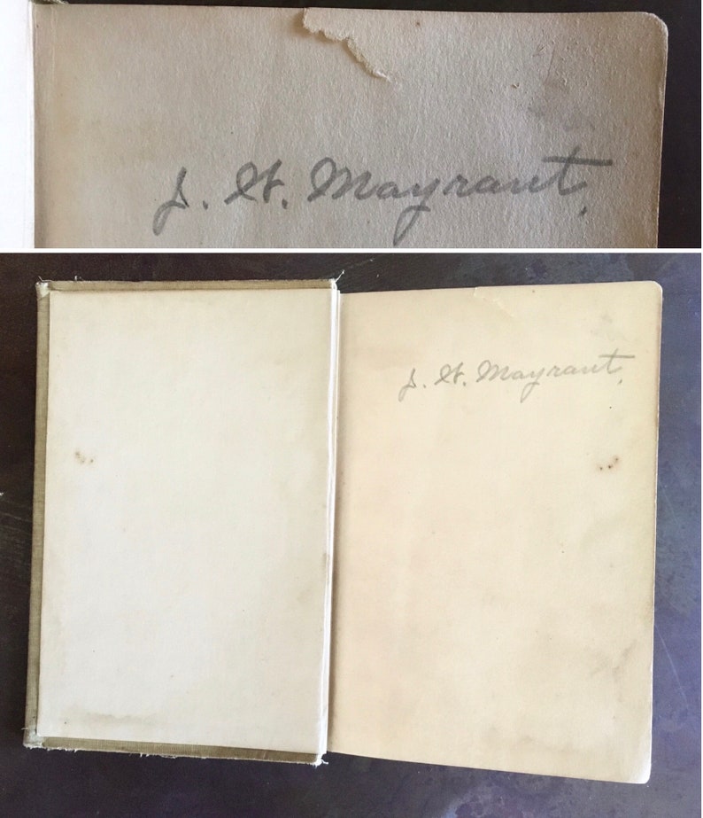 May include: A close-up of the inside cover of a book with a handwritten inscription that reads "J. H. Mayrant."