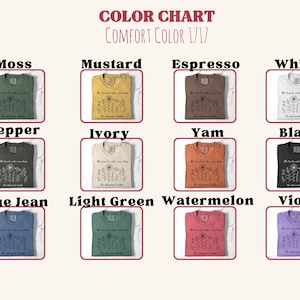 May include: A color chart for Comfort Color 1717 t-shirts displaying twelve folded shirts in moss, mustard, espresso, white, pepper, ivory, yam, black, blue jean, light green, watermelon, and violet, each featuring a floral graphic and text.