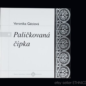 May include: A white book with the title "Paličkována čipka" by Veronika Gečiová. The book cover features a decorative lace border.
