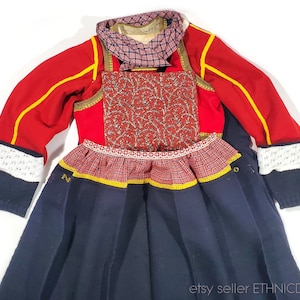 Dutch woman&#39;s folk costume from Marken, Netherlands | traditional clothing skirt shirt apron vest scarf | red wool top ethnic dress vintage