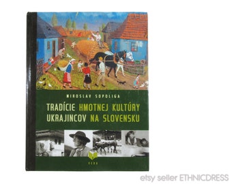 May include: A green book cover with the title "Tradície hmotnej kultúry Ukrajincov na Slovensku" and the author's name "Miroslav Sopoliga". The cover features a colorful illustration of a rural village scene with people, houses, and a horse-drawn cart.