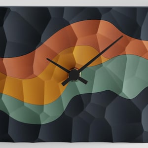 May include: Square wall clock with a textured, dark blue background and a colorful, layered design in orange, yellow, and green. The clock features black hands and a black center, offering a modern, abstract aesthetic. The clock's design is reminiscent of a retro sunset.