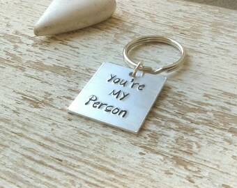 You're my Peron stamped key chain, you're my person