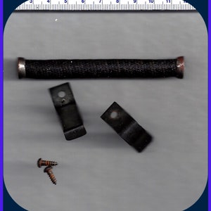 May include: A black metal rod with a black fabric covering, two metal brackets, and two screws. The rod is about 7 inches long.