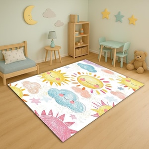 Könnte beinhalten: Ein rechteckiger weißer Teppich mit einem farbenfrohen, skurrilen Design mit lächelnden Sonnen, Wolken und Sternen. Der Teppich ist für ein Kinderzimmer konzipiert, mit einer verspielten und fröhlichen Ästhetik. Der Teppich ist aus weichem Material.