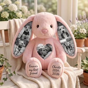 May include: A soft pink plush rabbit featuring black and white photo prints on its long ears and a heart-shaped chest patch. The left foot is embroidered with "Forever my best friend" and the right foot with "Charlie 2014-2026" in black script.