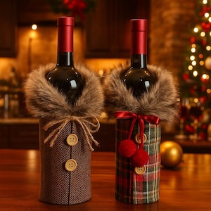 May include: Two wine bottles with decorative covers. One cover is brown herringbone with buttons and a faux fur collar. The other is a red and green plaid with red pom-poms and a faux fur collar. Festive holiday decor.