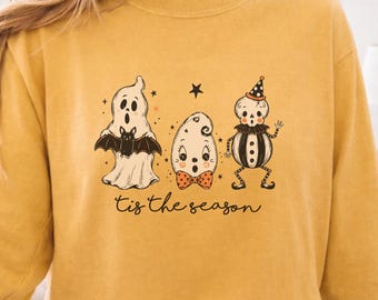 Camiseta unisex de manga larga con estampado de fantasmas vintage para Halloween, colores otoñales apagados.