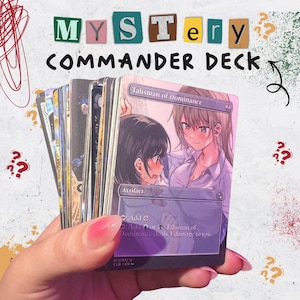 May include: A hand holding a deck of "Mystery Commander" trading cards. The cards feature anime-style artwork and text that reads "Talisman of Dominance" and "Artifact". The top of the image has the words "Mystery Commander Deck".