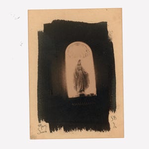 May include: Vintage sepia-toned postcard featuring an illustration of a religious figure within an arched frame, set against a dark, brushstroke-style background. The card has handwritten text in the lower left corner and a signature in the lower right.