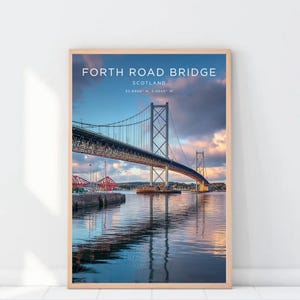 May include: A framed print featuring the Forth Road Bridge in Scotland. The image shows the bridge spanning across a body of water, with a vibrant sky overhead. Text at the top reads "FORTH ROAD BRIDGE SCOTLAND".