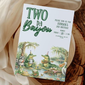 May include: A birthday invitation with the text "TWO DA Bayou" in green script. The invitation features illustrations of alligators, a raccoon, and frogs celebrating a birthday party in a bayou setting. The invitation also includes the party details.