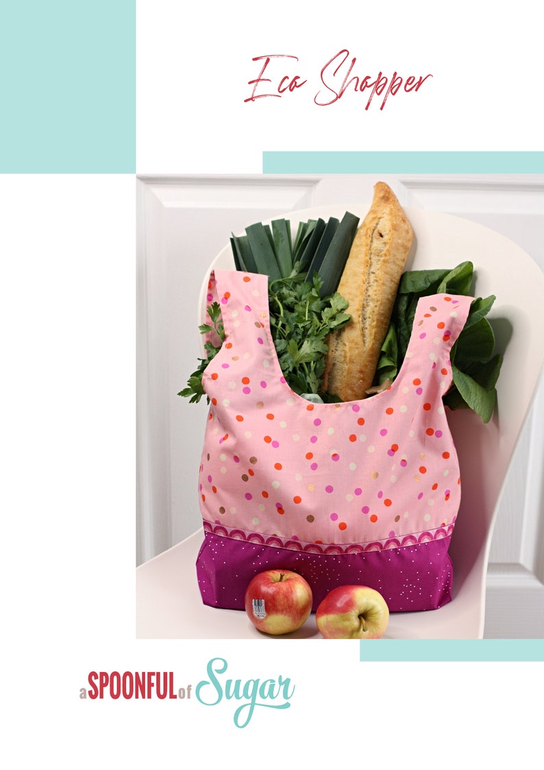May include: Pink reusable shopping bag with white polka dots and a purple trim. The bag is filled with groceries, including a baguette, leeks, and parsley. Two red apples are in front of the bag. The text "Eco Shopper" is at the top of the image and "a SPOONFUL of Sugar" is at the bottom.