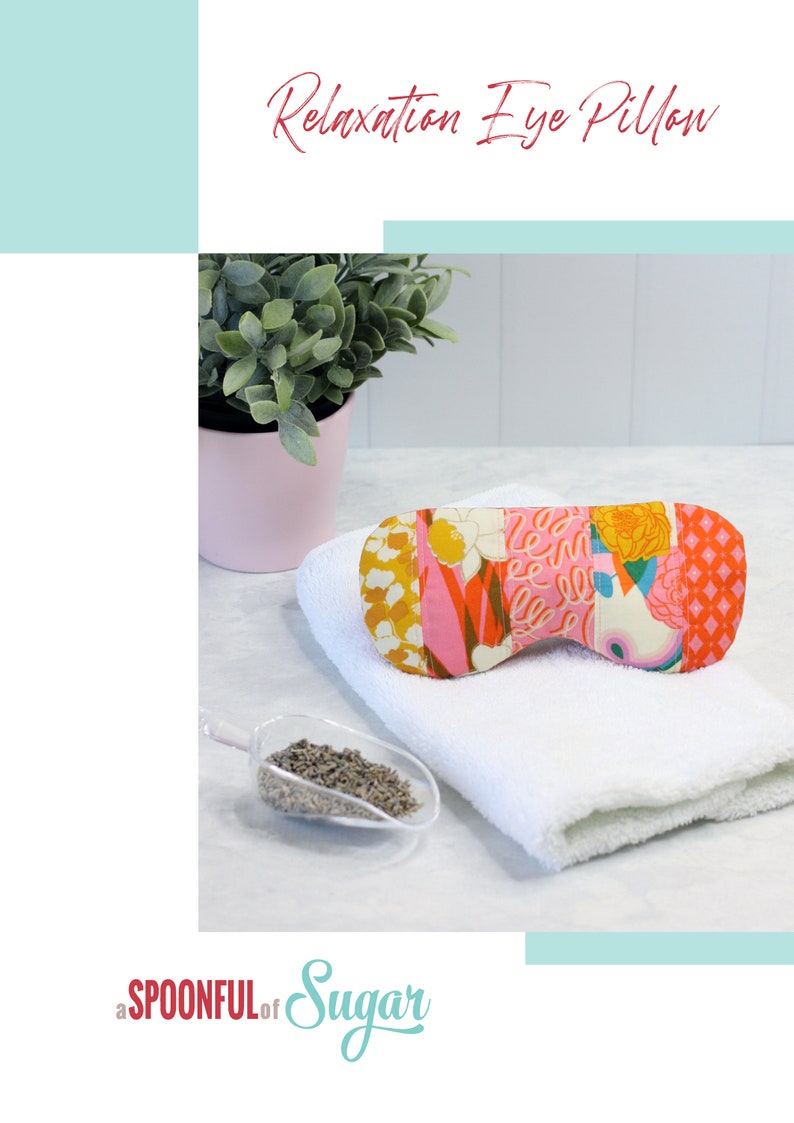 May include: A colorful patchwork eye pillow with a white background and pink, orange, yellow, and green floral patterns. The eye pillow is on a white towel with a small scoop of dried lavender next to it.