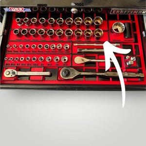 May include: A Craftsman tool set organized in a black toolbox with a red insert. The set includes various sockets, ratchets, and extensions. The sockets are labeled with sizes in inches and millimeters.